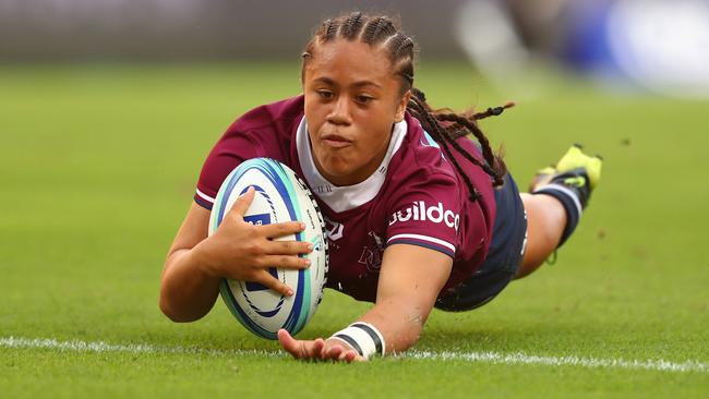 Replacement Reds halfback Destiny Brill scores a try against the Melbourne Rebels at Suncorp Stadium. Photo: Chris Hyde/Getty Images