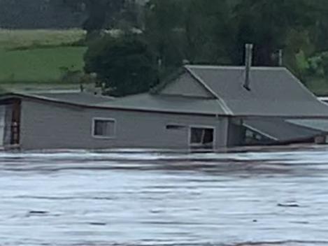 FEES APPLY. ONE TIME USE ONLY. MUST CREDIT.  House swept away in floodwaters in West Taree, NSW. Robert Cribb / Severe Weather Australia ,