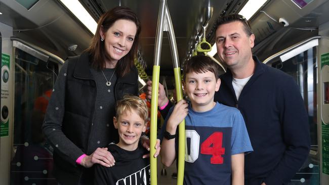 Louise and Paul Pollard and children Lachlan, 11, and Callum, 8 on board the train. Picture: David Swift