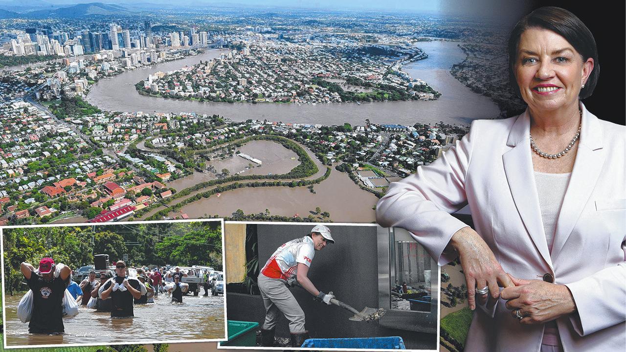 Anna Bligh now says she can appreciate her contribution to preparing Queensland psychologically as the 2011 floods hit. Main: Brisbane during the floods. Inset right: Ms Bligh helping out at a flooded apartment complex in West End in 2011.