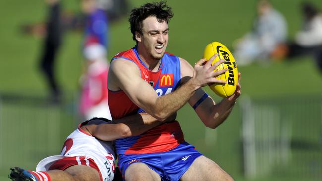 Max Duffy is tackled by Marlion Pickett.