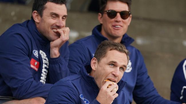 Joel Selwood tucks into a burger in the crowd in Colac ahead of Geelong’s pre-season game against Essendon.