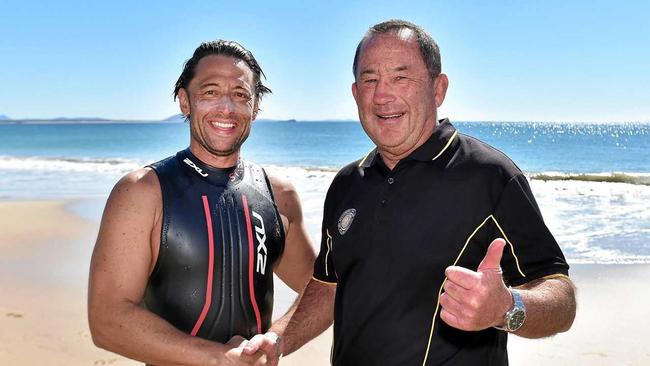 Brendan Neil, pictured with Ashley Robinson, has completed 10 Mudjimba Island Charity Swims to raise money for specials schools. Picture: Patrick Woods