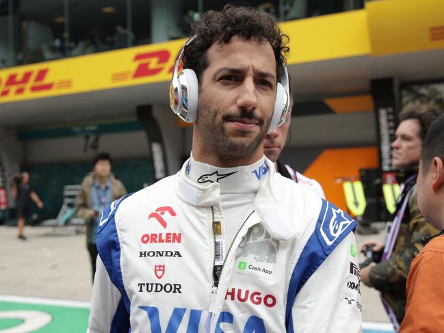 RB's Australian driver Daniel Ricciardo looks on before the sprint race ahead of the Formula One Chinese Grand Prix at the Shanghai International Circuit in Shanghai on April 20, 2024. (Photo by Andres Martinez Casares / POOL / AFP)