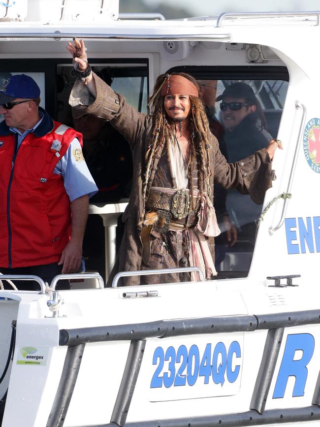 Johnny Depp leaves on a boat to be ferried out to Moreton Bay to continue filming Pirates of the Caribbean. Picture: Liam Kidston