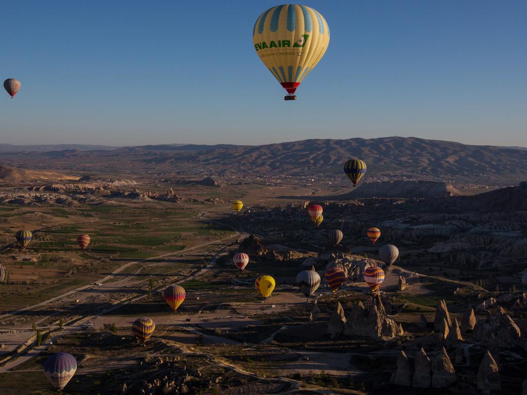 Tourists ride hot air balloon near the town of Goreme on April 17, 2016 in Nevsehir, Cappadocia, Turkey. Picture: Getty