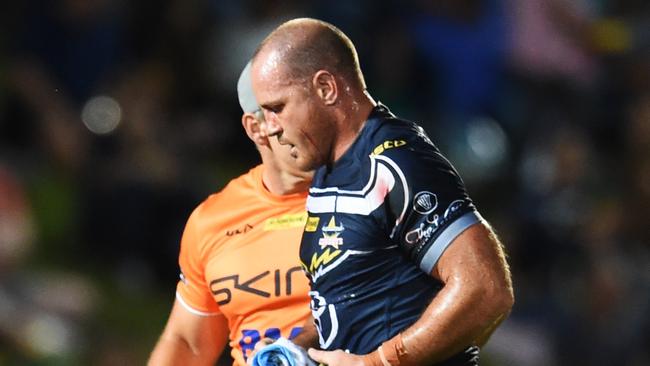 Matt Scott was helped off after injuring his knee against the Rabbitohs. Picture: Zak Simmonds