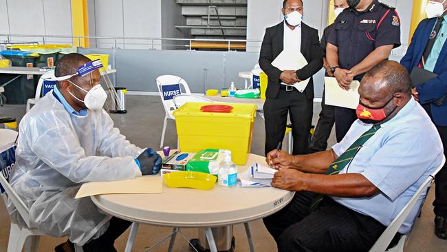 Papua New Guinea’s Prime Minister, James Marape, prepares to receive a dose of the AstraZeneca COVID-19 vaccine in Port Moresby. Picture: AFP