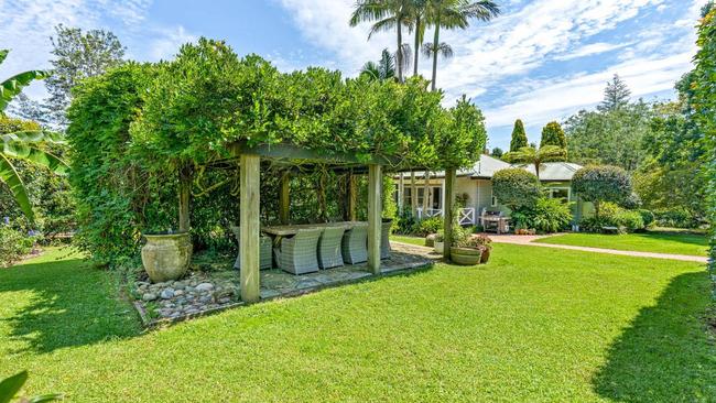 There are garden alcoves, a stunning wisteria-covered arbour, fruit trees, plus garden beds for vegetables. Picture: Supplied