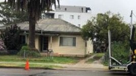 One of the houses to be demolished if the units are approved.