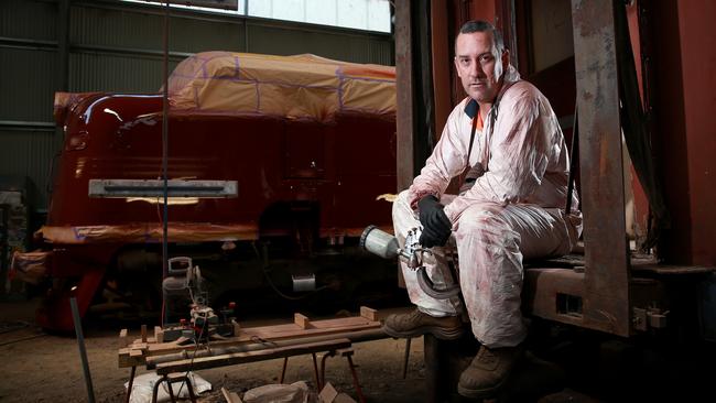 Lithgow spray painter Scott Morrison pictured in his factory where he is restoring an old locomotive. Picture: Toby Zerna