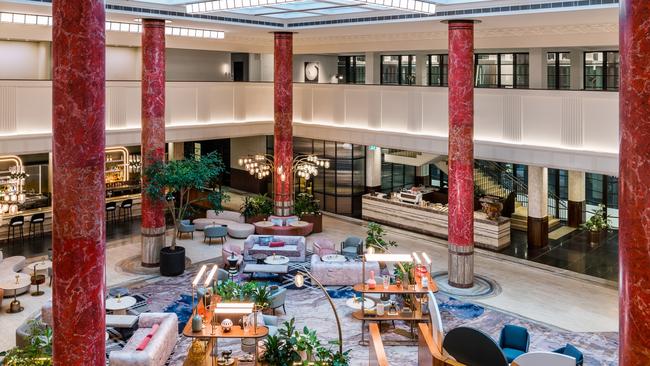 Red scagliola columns dominate the lobby at Kimpton Margot Sydney.