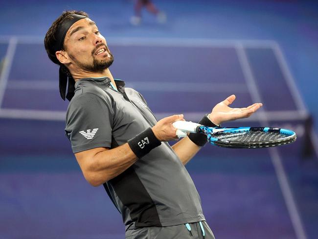 TOPSHOT - Italy's Fabio Fognini complains to the umpire while playing against Italy's Salvatore Caruso during their men's singles match on day four of the Australian Open tennis tournament in Melbourne on February 11, 2021. (Photo by David Gray / AFP) / -- IMAGE RESTRICTED TO EDITORIAL USE - STRICTLY NO COMMERCIAL USE --