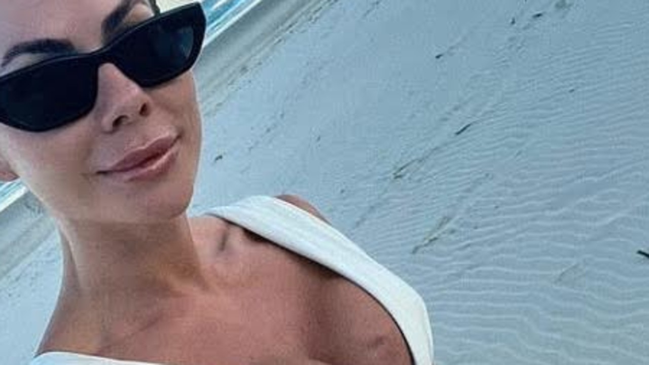 The fitness expert was sharing photos to Instagram of her weekend when fans noticed the lump near the centre of her chest. Picture: Instagram / Sophie Guidolin