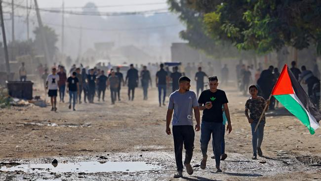 Palestinians move towards the Nahal Oz border crossing with Israel, east of Gaza City. Picture: Mahmud Hams / AFP