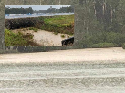 Woolgoolga Lake was turned brown after runoff from nearby developments flowed into the waterway.