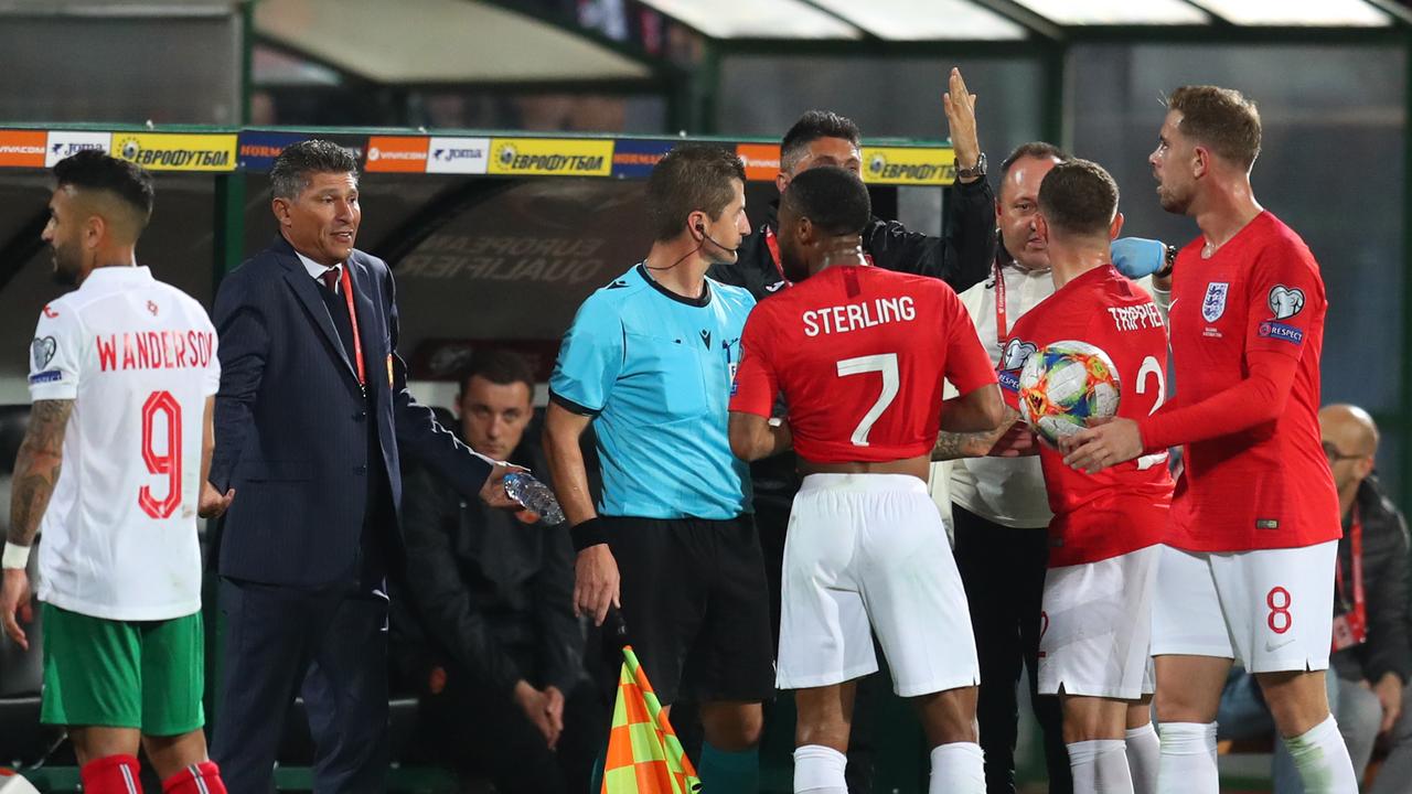 Raheem Sterling, Kieran Trippier and Jordan Henderson speak with Krasimir Balakov manager of Bulgaria during the controversial UEFA Euro 2020 qualifier between Bulgaria and England.