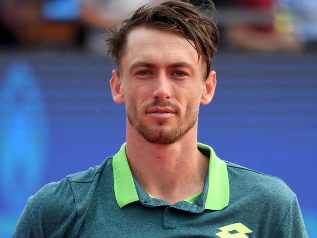 Australian John Millman poses with his trophy after he finished second at the Hungarian Open in Budapest, on April 29, 2018 following hist ATP final tennis match against Italian Marco Cecchinato. / AFP PHOTO / ATTILA KISBENEDEK