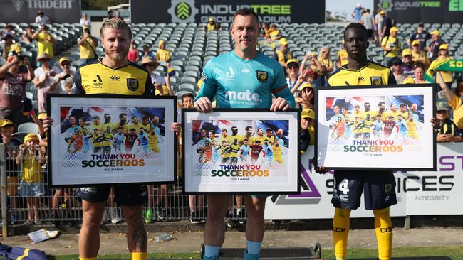 Jason Cummings, Danny Vukovic, and Grang Kuol of the Mariners receive thank you awards for the participation in 2022 Socceroos World Cup team.