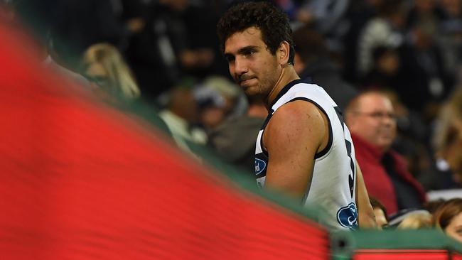 Nakia Cockatoo looks forlorn after being forced to go down the race with injury against the Bulldogs. Picture: AAP