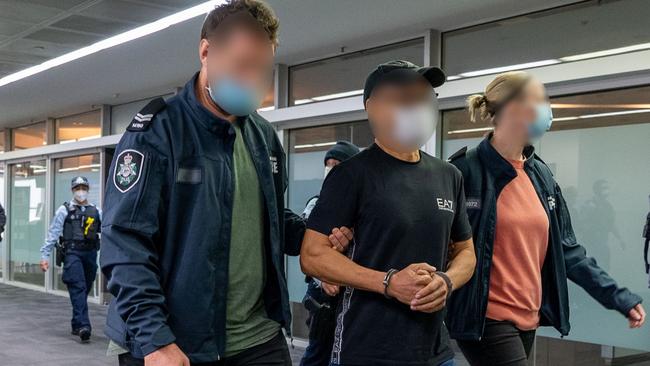 Australian Federal Police escort Chung Chak Lee. He has been accused of being a key player in The Company (Sam Gor) cartel. Picture: Supplied.