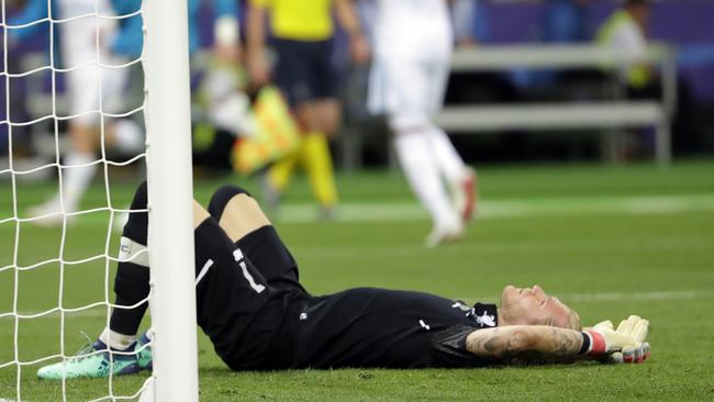 Liverpool goalkeeper Loris Karius lies on the field after during the Champions League final in Kiev, Ukraine. Doctors concluded five days after the match Karius sustained a concussion that would have affected his performance