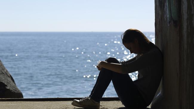Teen girl lonely and sadness on the beach Mental health generic thinkstock Girl depressed on the beach female sad depressed lonely suicidal teenager Depression generic Mental illness Sexual abuse generic