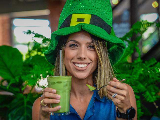 St Patrick's Day. Nicole Sumracki (owner of Nutrition Republic) with a green smoothie and mint cake.Thursday March 8th, 2018. (AAP Image/Roy Vandervegt)