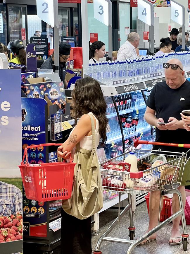 Lines of people at Coles in New Farm, in inner Brisbane.