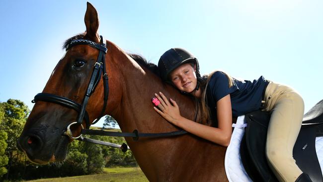 Nickola McNabb back on her horse with her repaired finger. Picture: Adam Head