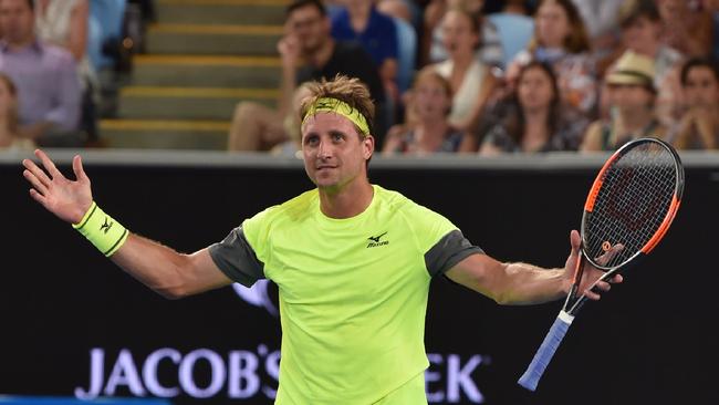 Tennys Sandgren of the US celebrates beating Switzerland's Stanislas Wawrinka in their men's singles second round match on day four of the Australian Open. Picture: AFP