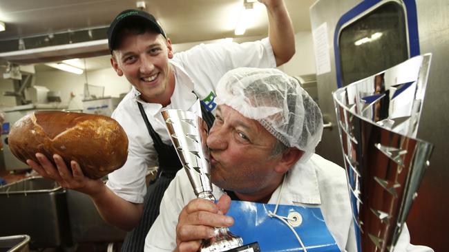 LOcal butcher, TasMeats, wins a national award for ham, it's start of pork week, and we have some succilent leg of hams on the bone ready for Christmas, ,, picture of butcher Nathan Grant with process manager Phillip Bowden in the factory. with ham and trophies,, picture kim eiszele