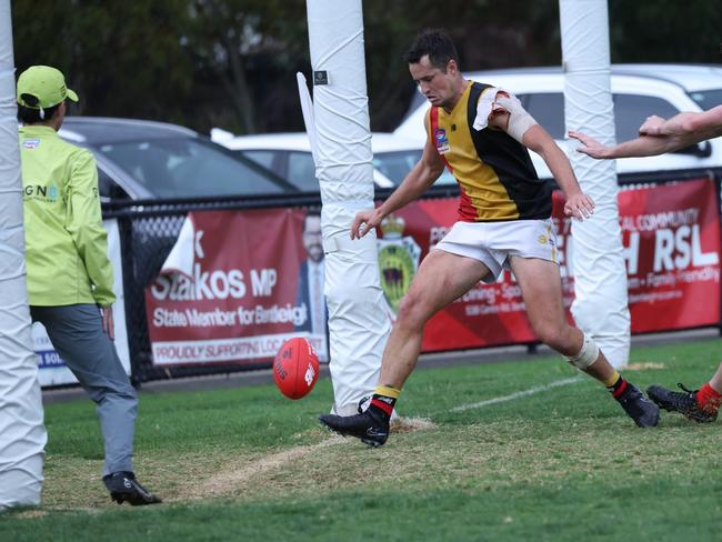 Cheltenham captain Jack Worrell kicks a goal in the final quarter of his 200th game. Picture: Andrew Keech.