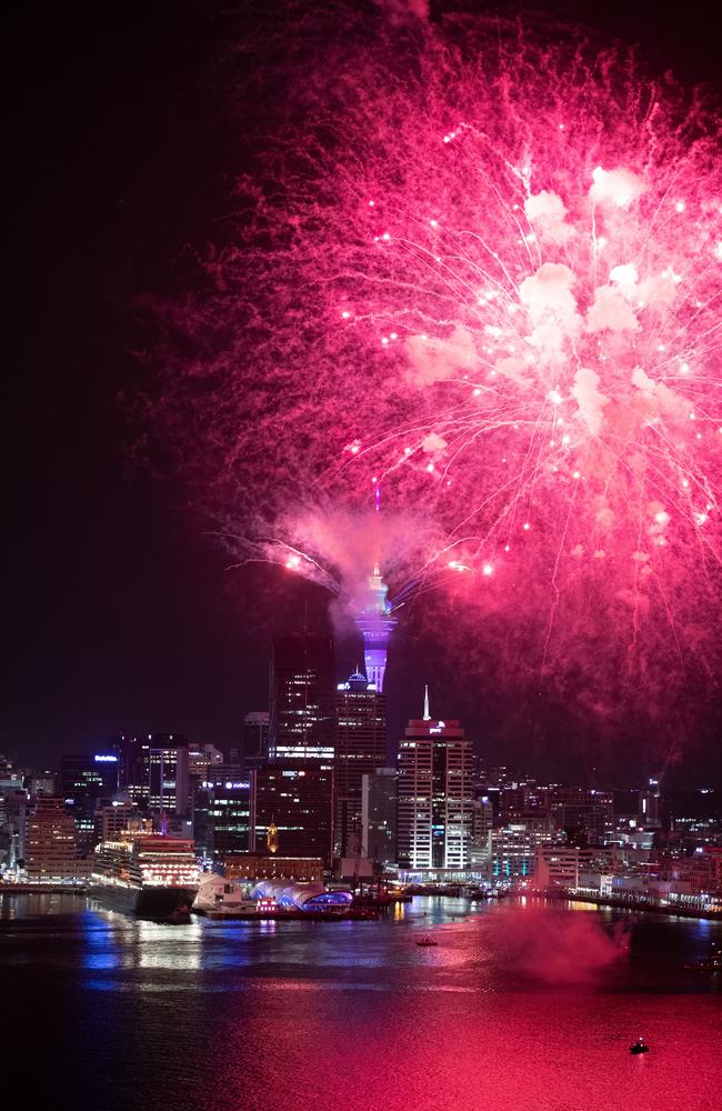 Fireworks are seen exploding from the Aucklands Waitemata Harbour and Sky Tower during the Auckland New Year's Eve celebrations. Picture: Getty