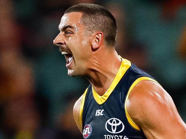 ADELAIDE, AUSTRALIA - JULY 20: Taylor Walker of the Crows  celebrates after kicking a goal during the round 7 AFL match between the Adelaide Crows and the St Kilda Saints at Adelaide Oval on July 20, 2020 in Adelaide, Australia. (Photo by Daniel Kalisz/Getty Images)