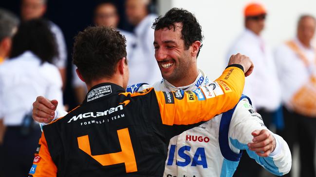 Ricciardo embraces Lando Norris after his old teammate won his first race at the Miami Grand Prix. (Photo by Mark Thompson/Getty Images)