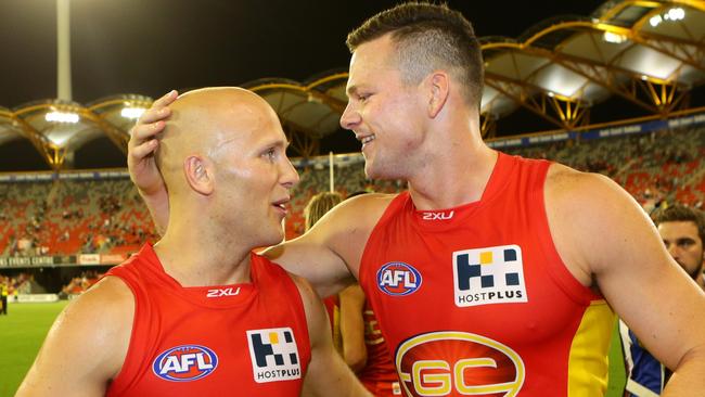 Gary Ablett and Steven May celebrate a Gold Coast win together. Picture: Darren England