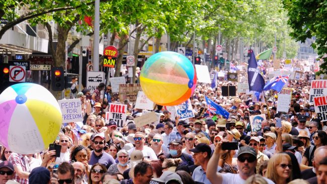 Protesters held up signs such as 'kill the bill' as they rallied against Victoria's new pandemic laws.  Picture: NCA NewsWire / Luis Ascui