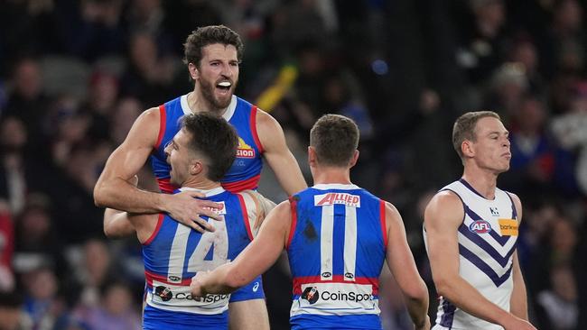 MELBOURNE, AUSTRALIA - JUNE 15: Marcus Bontempelli of the Bulldogs celebrates kicking a goal during the round 14 AFL match between Western Bulldogs and Fremantle Dockers at Marvel Stadium, on June 15, 2024, in Melbourne, Australia. (Photo by Daniel Pockett/Getty Images)