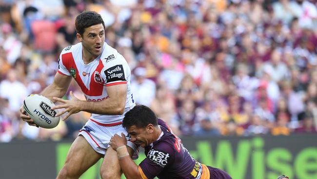 Ben Hunt looks to get an offload away for the Dragons against the Broncos at Suncorp Stadium. Picture: AAP