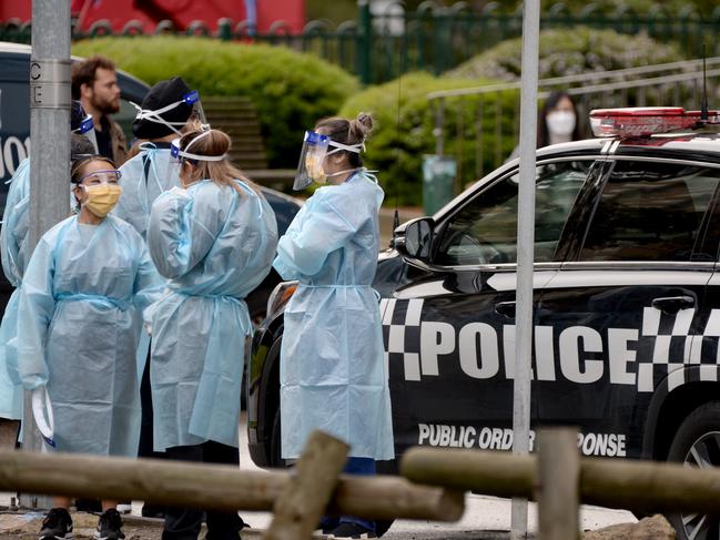 Medical staff prepare to enter the Flemington public housing estate after it was put into lockdown on Saturday. Picture: NCA NewsWire / Andrew Henshaw