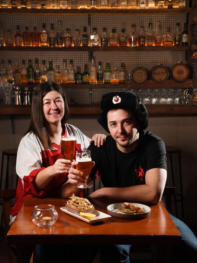 Red October co-owners Marina Tazhdynova and Roman Tazhdynov with fish and chips and chebureki. Pic: Tricia Watkinson