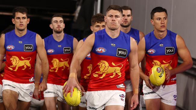 Dayne Zorko leads the Lions out.