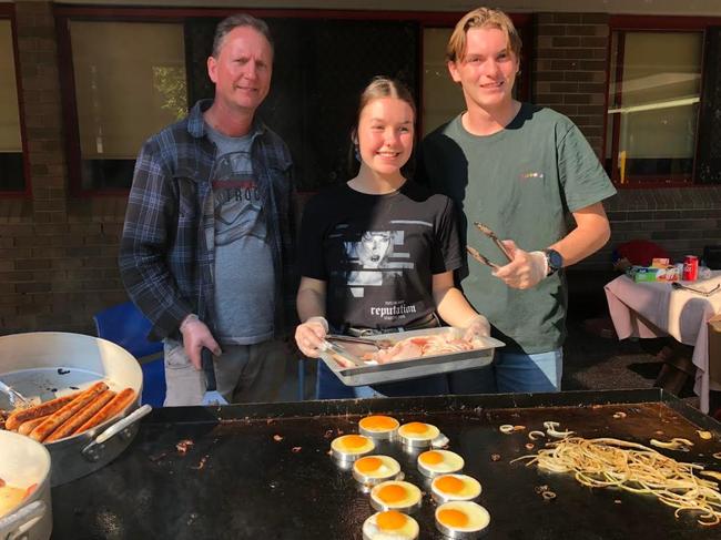 People manning the barbecue in Sydney's west