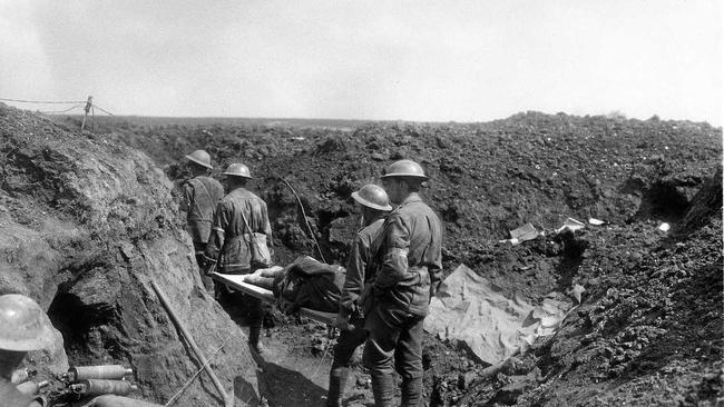 Stretcher bearers of the 8th Battalion carry wounded soldiers back along the trenches during the fighting at Bullecourt. Picture: Australian War Memorial (E00440)