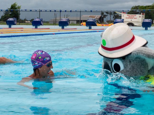 Jeanette Farrugia from Mackay SES and Blazer in the pool at the Mackay Aquatic & Recreation Complex for the Fire and Rescue Service, Movember event consisting of a 60km pool swim.Blazer is Inspector Jock Crome.Picture: Michaela Harlow