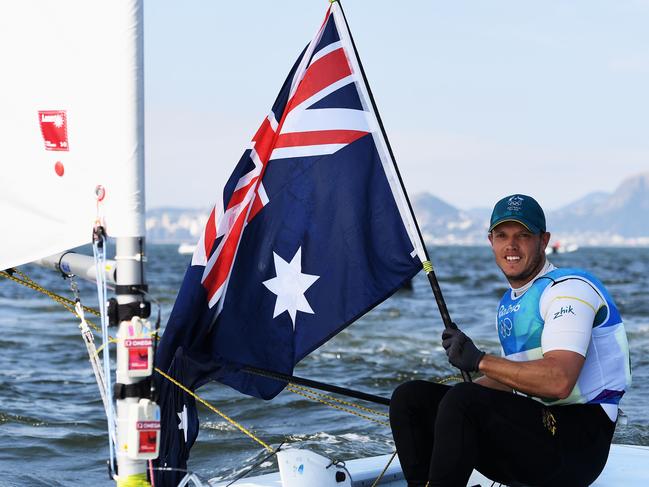 RIO DE JANEIRO, BRAZIL - AUGUST 16: Tom Burton of Australia celebrates winning the gold medal in the Men's Laser class on Day 11 of the Rio 2016 Olympic Games at the Marina da Gloria on August 16, 2016 in Rio de Janeiro, Brazil. (Photo by Laurence Griffiths/Getty Images)