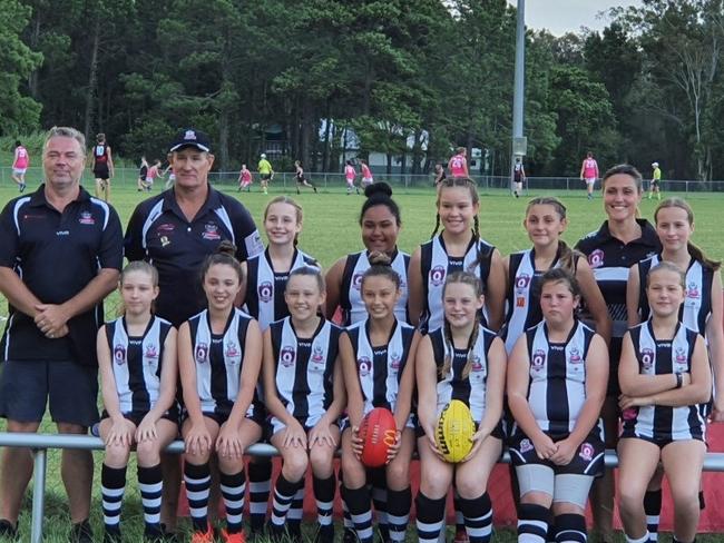 Zoe Warburton is front row holding the red rootball.