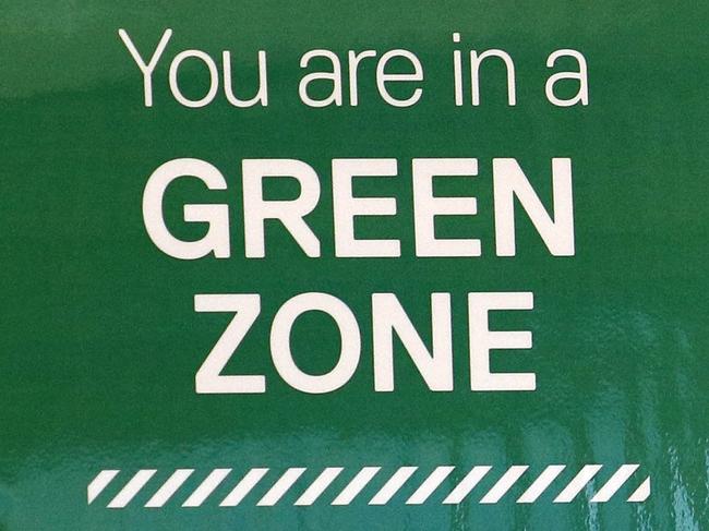 BRISBANE, AUSTRALIA - NewsWire Photos APRIL 30, 2021: General views of signage showing red and green zones at the Brisbane International arrivals hall. Picture: NCA NewsWire/Tertius Pickard