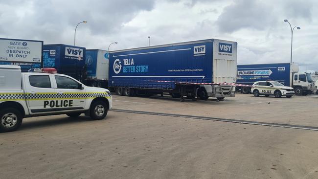 Emergency services at the scene of an industrial accident in Gepps Cross. The truck is parked behind the trailer. Picture: Andrew Hough